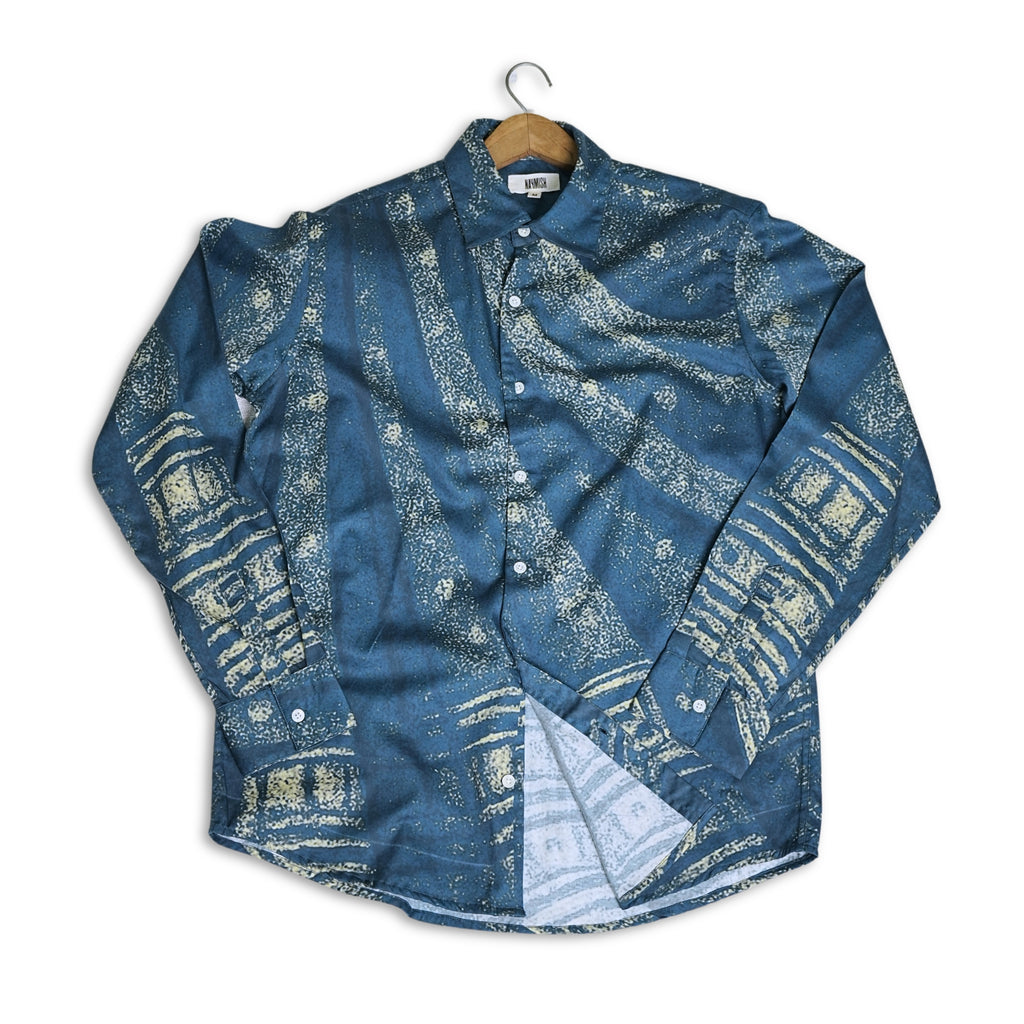 Blue patterned shirt on a hanger against a white background