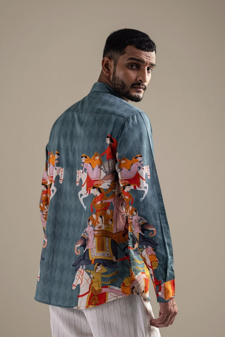 Man wearing the Kirtharjuna shirt, close back view, looking over his shoulder