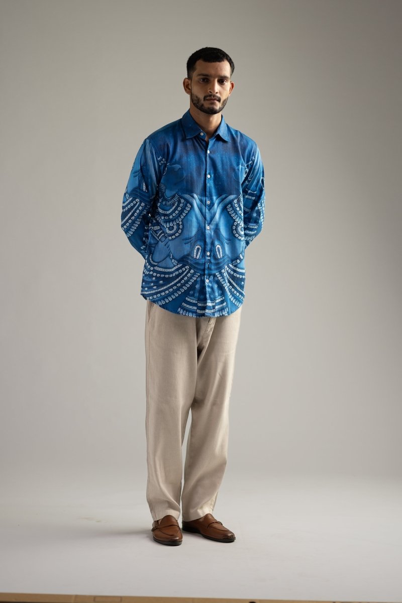 Man wearing the Vanaryugalam shirt with cream trousers, full length front view, arms by his sides